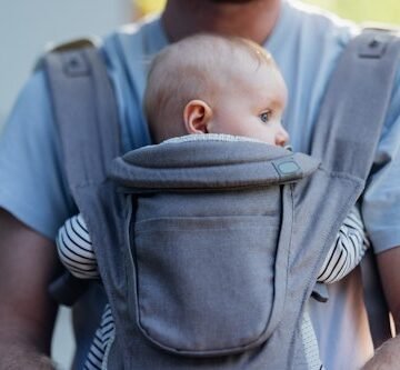 Baby Dolls In Slings Are Tied To Statues In Paternity Leave Protest