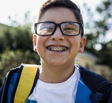 school-age-boy-laughing Your Kid Is Getting Braces: What To Expect, From A Mom Who Just Had Them