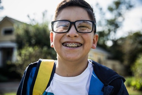school-age-boy-laughing Your Kid Is Getting Braces: What To Expect, From A Mom Who Just Had Them