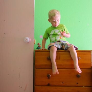 small-child-sitting-on Anchoring Furniture Can Save A Child's Life: Consumer Reports Found The Best Kits