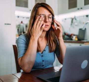 stressed-woman-working-from Do I Need Glasses? 4 Signs It's Time For Some New Lenses