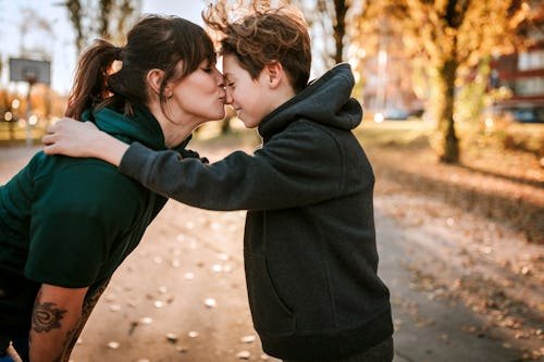 young-woman-kissing-embracing I Need My Kid To Stop Calling Me “Bro”
