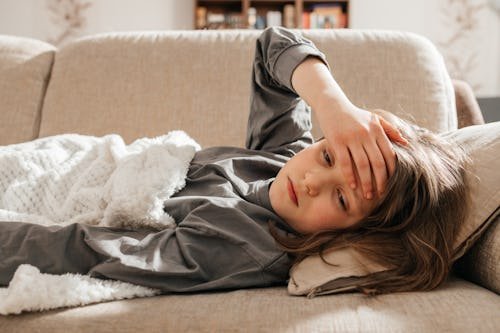 a-sick-dark-haired How To Help A Kid Afraid Of Throwing Up