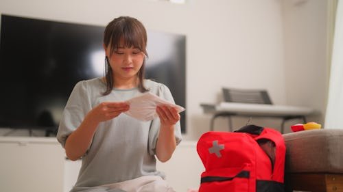 a-woman-is-preparing What Important Documents Do You Need In An Evacuation?