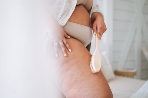 crop-photo-of-young Does Dry Brushing Help Tighten Loose Skin? An Expert Explains
