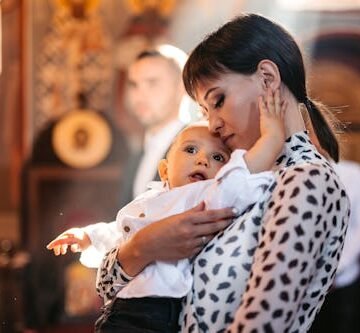 gettyimages-1446221398 I Brought My Baby To A Funeral, & It Was Profoundly Life-Affirming