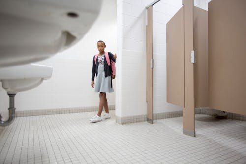 gettyimages-574894279 Kid Refuses To Poop At School? Here's What To Do