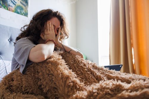 mental-burnout-caucasian-brunette Dreams Of Being Cheated On? Here's Why You're Waking Up Mad At Your Partner