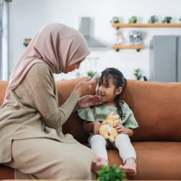 a-woman-using-a Best Way To Take Your Child's Temperature, Ranked
