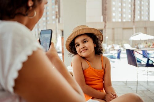 mother-taking-a-photo Utah Becomes Fourth State To Create Protections For Child Influencers