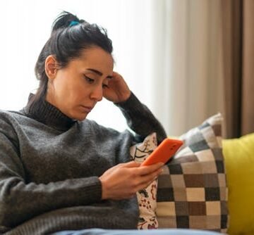 woman-sitting-on-a Climate Anxiety: What It Is & How To Cope, According To Experts
