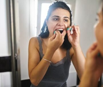 gettyimages-1264441420-1 Why Does My Floss Stink? Dentists Explain (Plus, Why Sniffing It Is Smart)