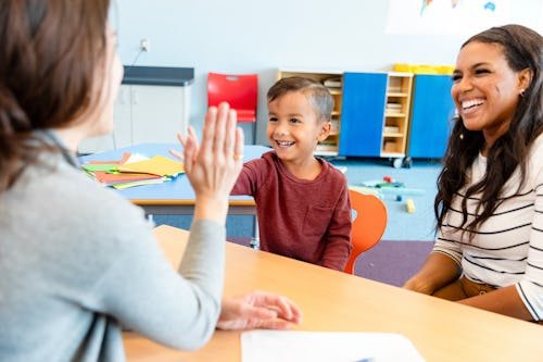 teacher-student-high-five New Jersey Law Would Give Parents Paid Time Off For School Events
