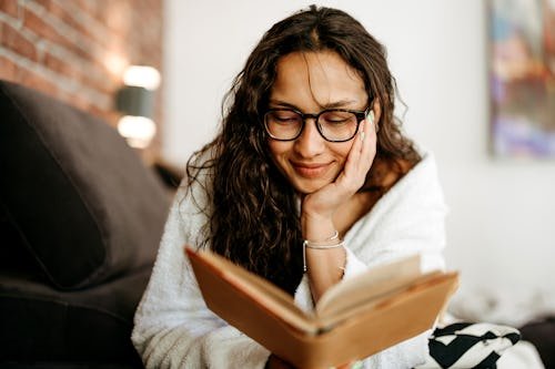 woman-is-lying-in 9 Enemies-To-Lovers Books With Excellent Ratings From Readers
