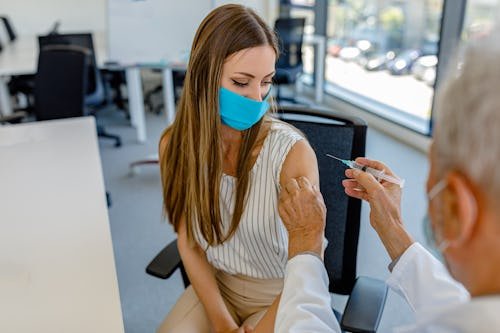 young-woman-her-doctor FDA Has Changed Covid Vaccine Policy, Some Fear Decreased Access & Uptake