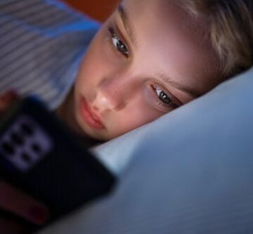 close-up-of-a When It Comes To Kids' Mental Health, It's Not The Screens, It's How They Use Them