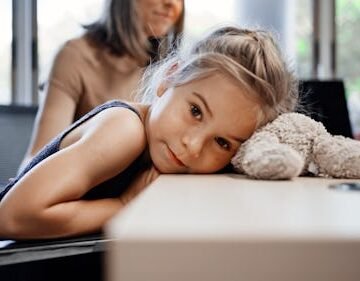 little-girl-rests-head Research Suggests More Children Have Long Covid Than We Thought — Thought The Symptoms Are Different