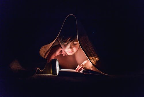 getty-1264132871 17 Spooky Books For Tweens, From Ghost Stories To Creepy Encounters