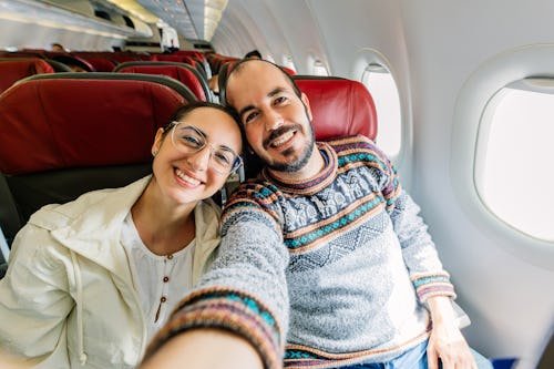 smiling-young-adult-couple Is A Getaway With Your Partner The Answer To Your Relationship Rut?