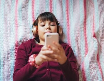 teenage-girl-lies-comfortably Teens Are Turning To "AI Companions" For Advice & Flirting (But Don't Panic Yet)