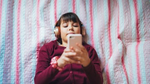teenage-girl-lies-comfortably Teens Are Turning To "AI Companions" For Advice & Flirting (But Don't Panic Yet)
